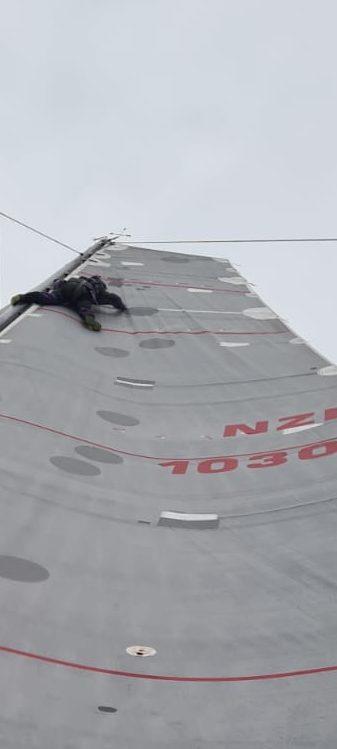 Wired's bowman a long way up the sails during the Auckland Three Kings Race - April 2022 photo copyright RNZYS Media taken at Royal New Zealand Yacht Squadron and featuring the IRC class