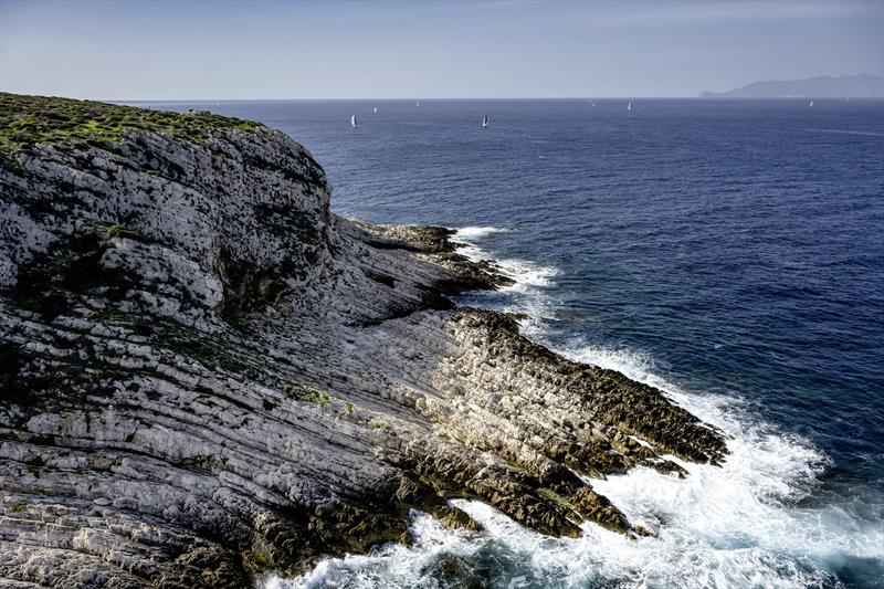 Rolex Middle Sea Race fleet passing Favignana photo copyright Kurt Arrigo / Rolex taken at Royal Malta Yacht Club and featuring the IRC class