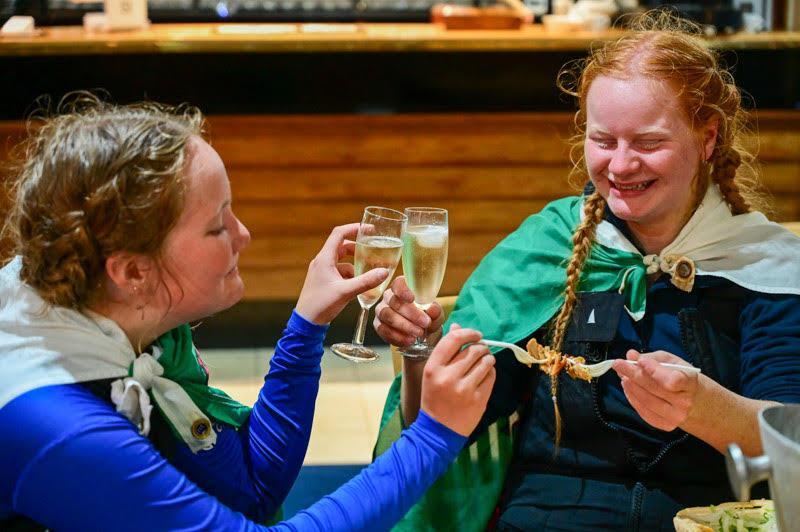 Lou and Elin celebrating their successful race with champagne and kebab - Round Britain and Ireland Race photo copyright fotocraft.net taken at  and featuring the IRC class