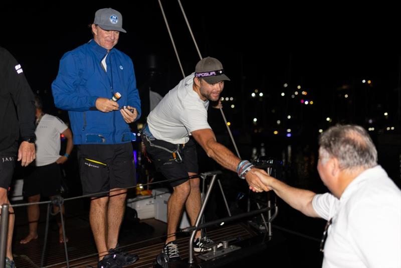 North Sails' Ken Read and team on Swan 115 Jasi - welcomed on the dock by the RORC Race Reporter and Race Team - RORC Transatlantic Race - photo © Arthur Daniel / RORC