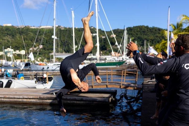 Fun and games in Port Louis as I Love Poland's skipper, Grzegorz Baranowski is thrown in the water at the trophy presentation photo copyright Arthur Daniel / RORC taken at Royal Ocean Racing Club and featuring the IRC class