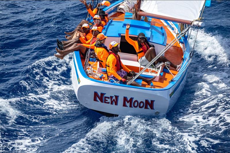 New Moon the smallest Carriccou sloop in the fleet with her colourful young crew - 2023 Antigua Classic Yacht Regatta photo copyright Patrick Sikes taken at Antigua Yacht Club and featuring the IRC class