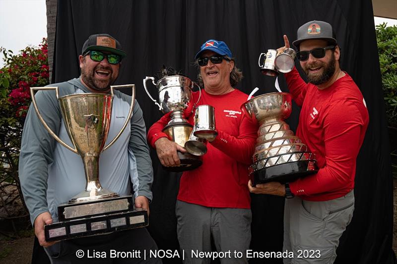 Three of the 10 cast and crew of Groundhog Day accept N2E's three top trophies photo copyright Lisa Bronitt taken at  and featuring the IRC class