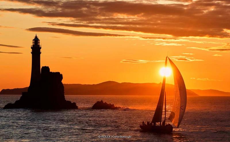 2023 Rolex Fastnet Race - Chris Sheehan's PAC 52 Warrior Won rounds the Fastnet Rock at dawn this morning photo copyright ROLEX / Carlo Borlenghi taken at Royal Ocean Racing Club and featuring the IRC class