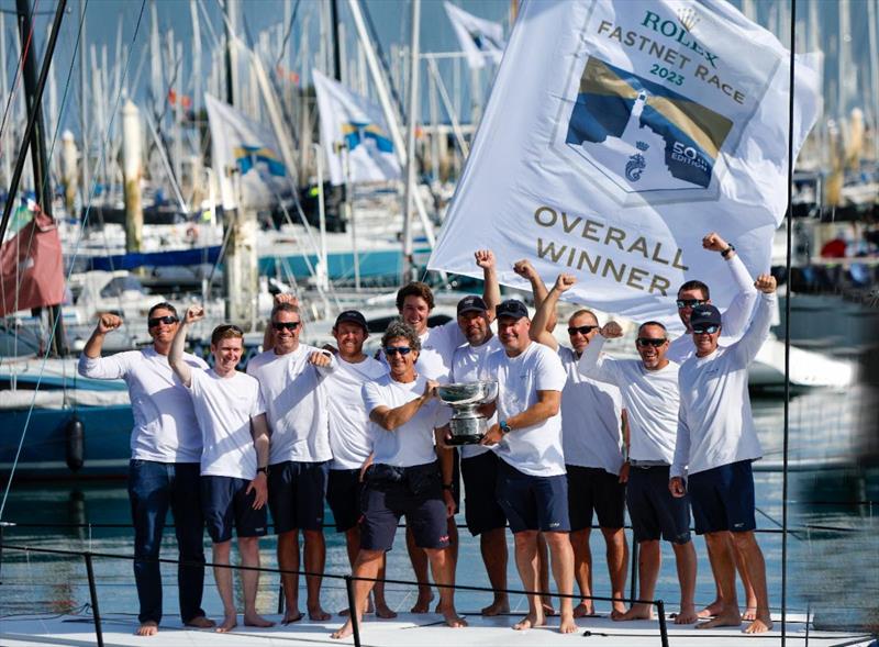 Max Klink (right) and tactician Adrian Stead (left) plus the Caro crew with the Rolex Fastnet Race overall winner's trophy - the Fastnet Challenge Cup - photo © Paul Wyeth / www.pwpictures.com