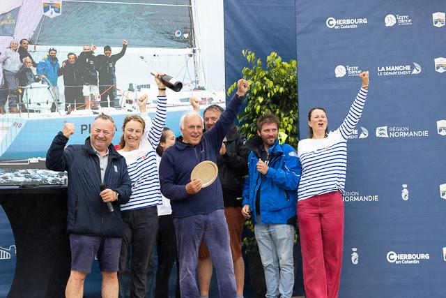 Gilles Fournier and his crew are awarded the trophy for winning IRC One in the Rolex Fastnet Race by RORC Commodore James Neville photo copyright RORC / Arthur Daniel taken at Royal Ocean Racing Club and featuring the IRC class