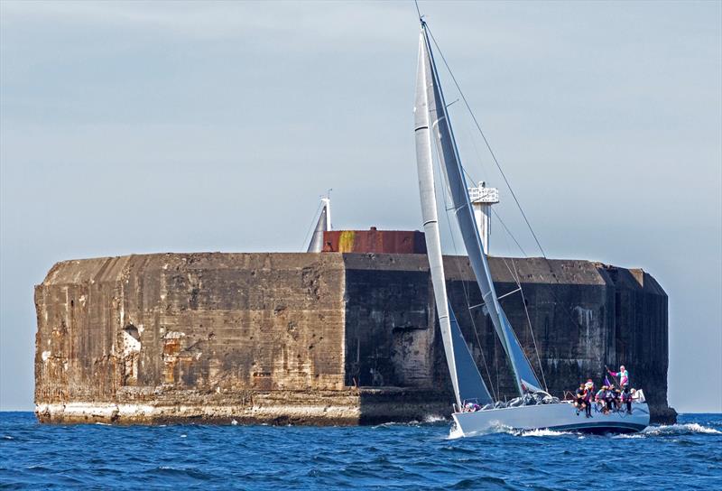 Karakoa gracefully rounds Fort Drum in a thrilling race against the picturesque and historic backdrop of Corregidor - photo © Guy Nowell