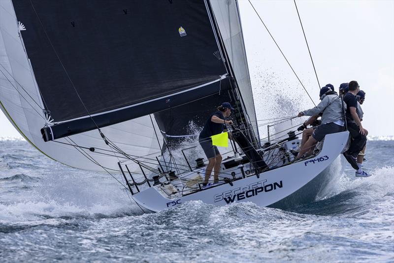 A reminder of Day 1 as Secret Weapon crew hold onto the kite in a big seaway - Ocean Dynamics and Mount Gay Airlie Beach Race Week 2024 photo copyright Andrea Francolini / ABRW taken at Whitsunday Sailing Club and featuring the IRC class