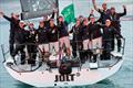 The crew celebrate on Peter Harrison's Botin 52 Jolt 3 - Admiral's Cup 2025 in the Rolex Fastnet Race