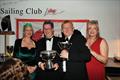 Peter Dunlop and Ian ‘Sammo' Jones collecting Mojito's trophies from Vice Commodore Victoria Cox and Commodore Lyndsay Harrold - Pwllheli SC Christmas Prize-giving