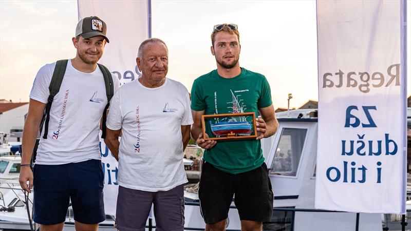 Gajeta Ilka, winner of the 23rd Regata za dušu i tilo, with her crew proudly posing with their prize in Betina - photo © Hrvoje Duvancic / regate.com.hr