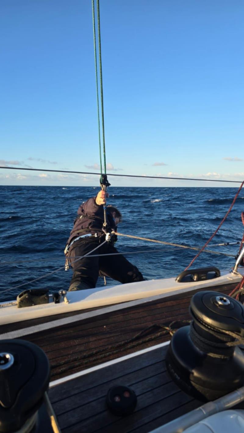 Callum Cecil retrieving a spinnaker sheet - 2025 Sydney to Auckland Ocean Race photo copyright Cooloola taken at Royal Prince Alfred Yacht Club and featuring the IRC class