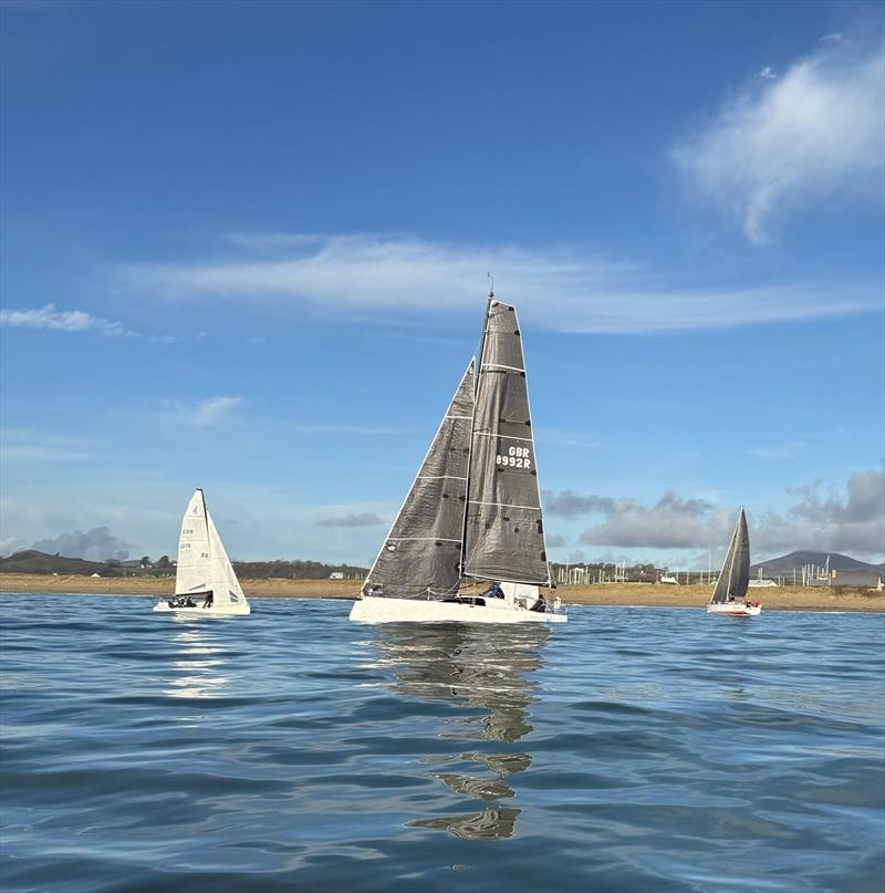 Pwllheli Winter Series Weekend 2 - Mojito Bach struggling to get back to the start line through the advancing fleet - photo © Vicky Cox