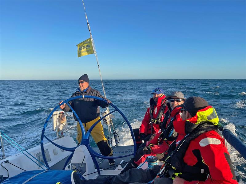 Race veteran Simon Dryden on the helm of Faster Forward chasing down The Jackal photo copyright Faster Forward taken at Ocean Racing Club of Victoria and featuring the IRC class
