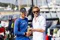 Sam Hall receives the IRC Two winners' prize from RORC Transatlantic Race Director Chris Jackson