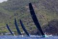 RP37 Warthog leading the fleet upwind along Antigua's rugged coastline - Antigua Racing Cup