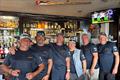 Jaha! crew members with the oar donated by Portishead CC to the bar in Crosshaven during Cork Week &copy; PCC