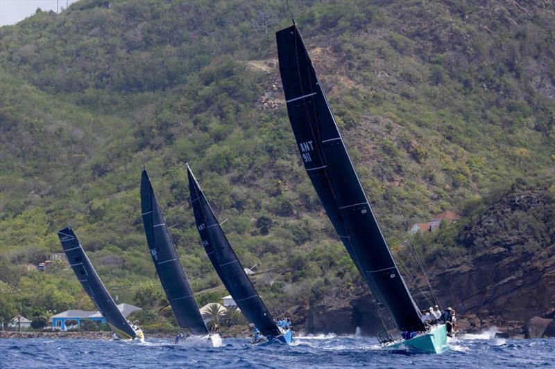 RP37 Warthog leading the fleet upwind along Antigua's rugged coastline - Antigua Racing Cup photo copyright Tim Wright / Photoaction.com taken at  and featuring the IRC class