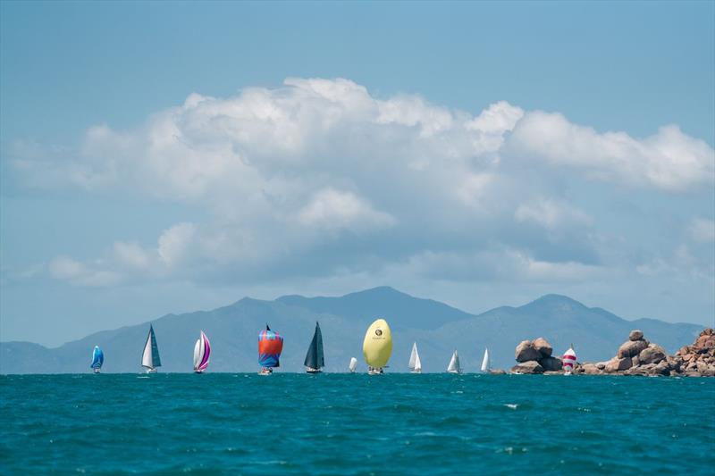 Orchard Rocks, Maggie Island backdrop and spinnakers make a dramatic picture - SeaLink Magnetic Island Race Week photo copyright Revolution Production taken at Townsville Yacht Club and featuring the IRC class