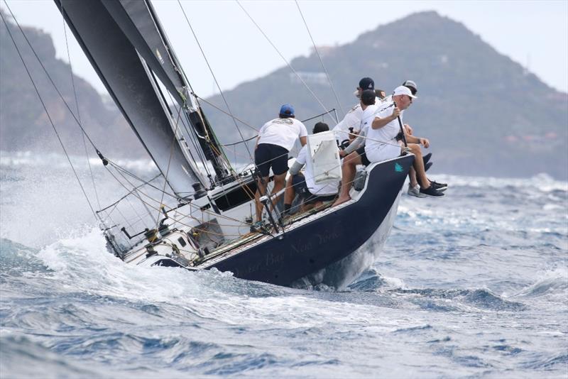 The Peacemaker team rides the waves in the Round the Rocks Race, finishing third photo copyright STIR / www.ingridabery.com taken at St. Thomas Yacht Club and featuring the IRC class