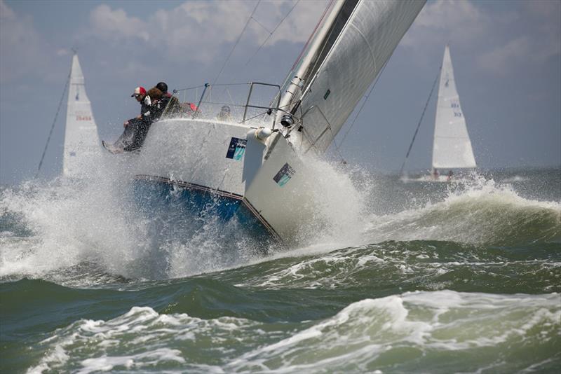 Submarine or sailboat? A J/boat gets pummeled by a big wave offshore on day 2 at Charleston Race Week photo copyright Charleston Race Week / Meredith Block taken at Charleston Yacht Club and featuring the J105 class