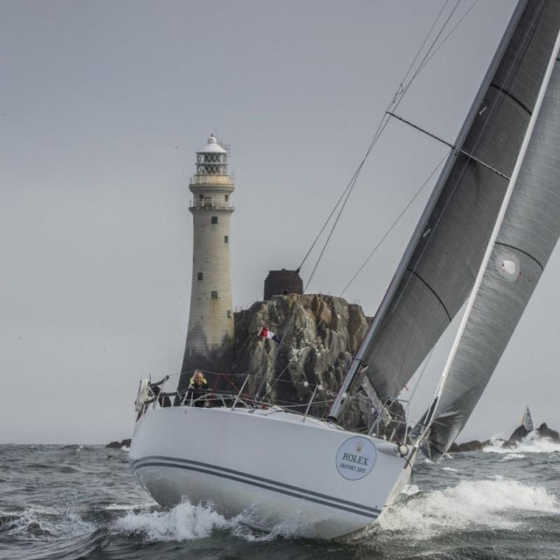 Neil McGrigor's two-handed J/109, rounds the Fastnet Rock photo copyright Daniel Forster / Rolex taken at Royal Ocean Racing Club and featuring the J109 class