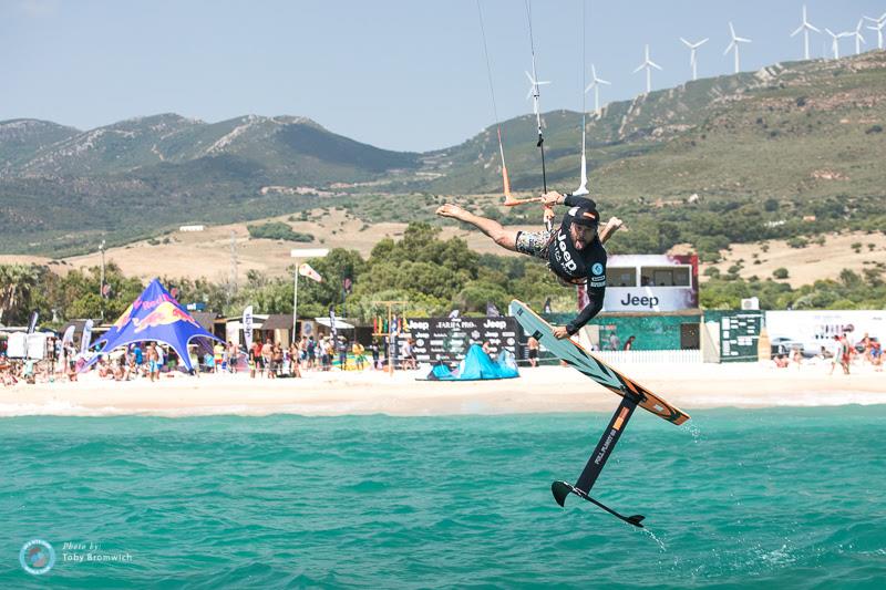 Don't worry, this is Tarifa! There was still enough Poniente wind to get wet with some form of shred! Javier Fernandez flinging the foil!  photo copyright Toby Bromwich taken at  and featuring the Kiteboarding class