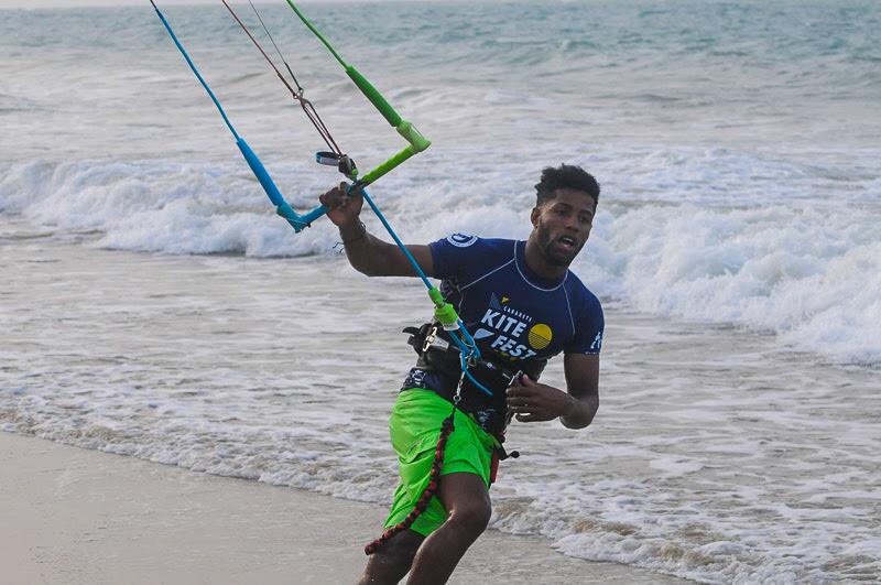 Posito sprints up the beach for an equipment change – a key tactic that all of the competitors have employed this week to make sure they're riding the right board or kite when going for big air or focusing on wakestyle tricks - photo © Event Media