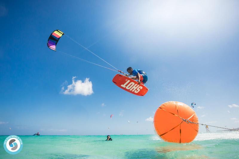 Carlos Mario sends one for the boys / buoys - GKA Kite World Tour - Freestyle World Fuerteventura 2019 photo copyright Romantsovaphoto taken at  and featuring the Kiteboarding class