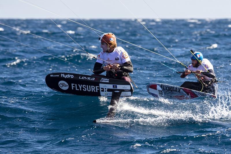 Theo de Ramecourt (FRA) (left)  following Maxime Nocher (FRA) (right)  around the right hand-bottom mark close enough to see the hairs raised on the back of Maxime's neck - 2020 Gran Canaria KiteFoil Open European Championships photo copyright IKA Media / Alex Schwarz taken at  and featuring the Kiteboarding class