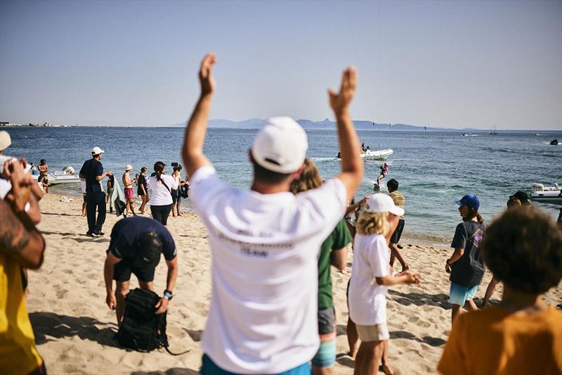 Nina Arcisz is welcomed ashore after her victory - Kitefoiling Youth World Championships  photo copyright Robert Hajduk / IKA media taken at  and featuring the Kiteboarding class