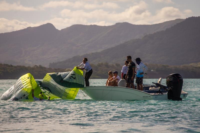 When the wind dies... Sofia Tomassoni helping out Gian Andrea Stragiotti photo copyright IKA Media taken at  and featuring the Kiteboarding class