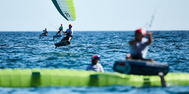 Flo Gruber (centre) picks his way through the finish-line carnage - 2023 Kitefoil World Series - photo © IKA Media / Robert Hajduk