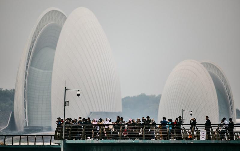 Spectators enjoying the action in front of the Zhuhai Opera House - 2023 KiteFoil World Series Final in Zhuhai, Day 3 photo copyright IKA Media / Robert Hajduk taken at  and featuring the Kiteboarding class