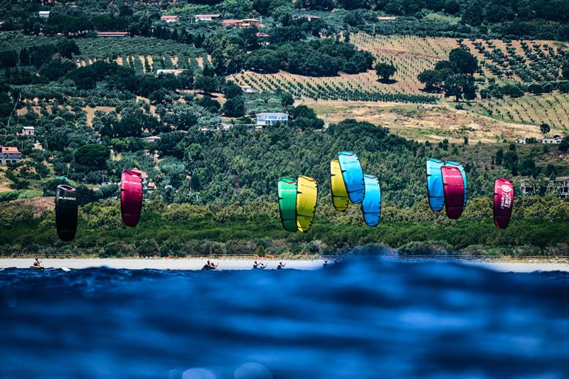 Colorful youthfoil kites against the Mediterranean backdrop of Calabria - photo © IKA Media / Robert Hajduk