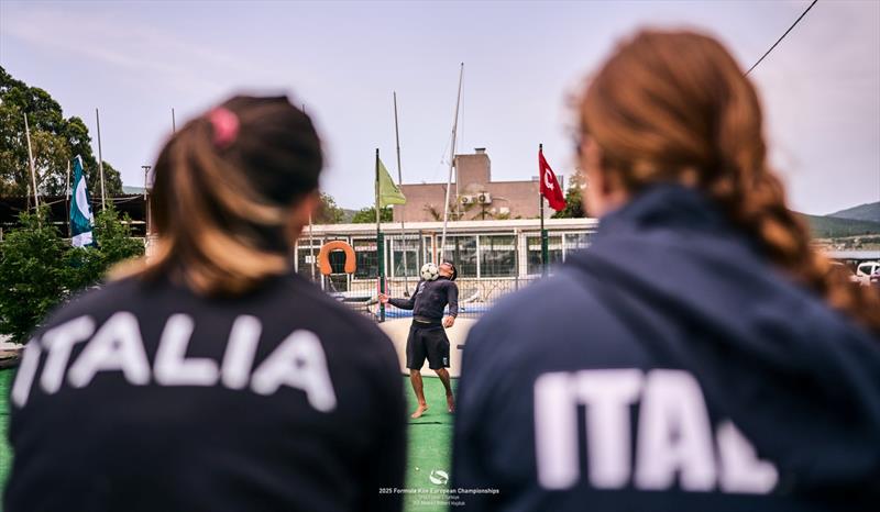 Italian riders kick back watching men's regatta leader Riccardo Pianosi test his football skills - photo © IKA Media / Robert Hajduk