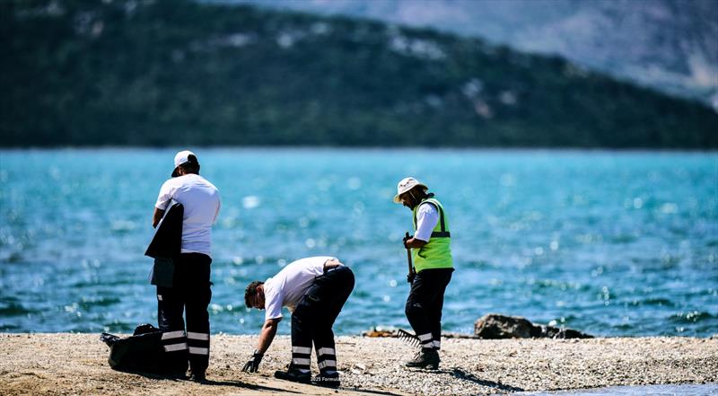 Event's Green Team catching plastics before it hits the water - photo © IKA Media / Robert Hajduk
