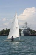 Lieutenant Richard Watsham sailing past HMS Echo alongside in Mombasa © Royal Navy