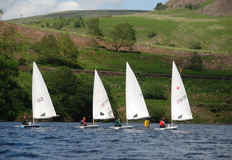 Tight racing during the Derbyshire Youth Sailing 2015 Series at Glossop photo copyright Phil Hewitt taken at Glossop Sailing Club and featuring the ILCA 7 class