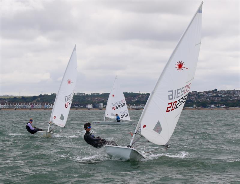 A puff of wind and Harry Newton leads Tom Oliver in a youth match at Laserfest 2019 at Whitstable photo copyright Nicky Whatley taken at Whitstable Yacht Club and featuring the ILCA 7 class