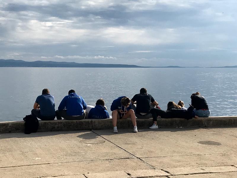 Another day waiting for the wind at the 2019 ILCA Laser Under-21 World Championships photo copyright Event Media taken at  and featuring the ILCA 7 class