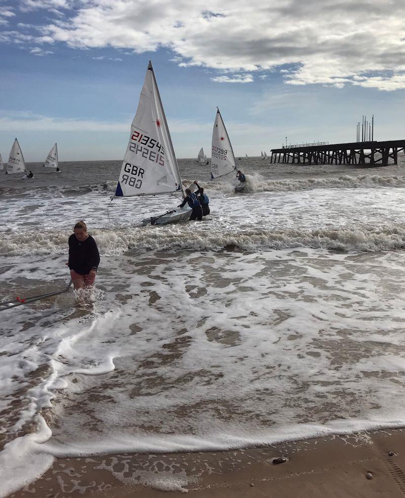 Tricky launching at the Laser UK World and European Qualifier at Royal Norfolk & Suffolk YC photo copyright Paul Jenkins taken at Royal Norfolk & Suffolk Yacht Club and featuring the ILCA 7 class