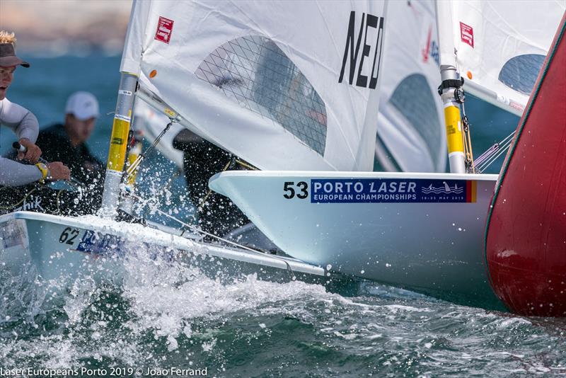 An Italian competitor finds a too small gap at the windward mark - Day 2 -  European Laser Championships - Porto - May 21, 2019 photo copyright Joao Ferrand - Fotografia taken at  and featuring the ILCA 7 class