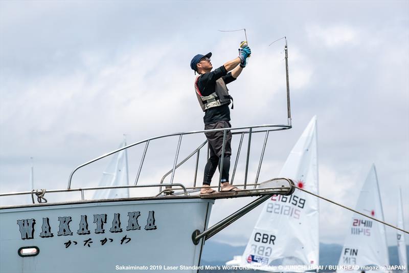 Measuring the breeze the old way - Day 6, World Laser Championship, Sakaiminato, Japan July 2019 photo copyright Junichi Hirai taken at  and featuring the ILCA 7 class