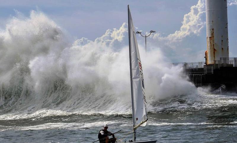 Typhoon generated waves crash against a seawall in Enoshima, Japan. has the storm passed for the laser class? photo copyright International laser Class Association taken at  and featuring the ILCA 7 class