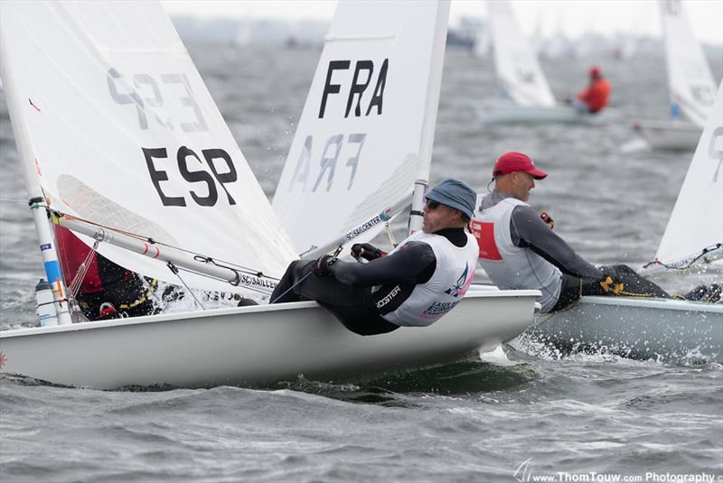 Jose Luis Doreste and Miguel Noguer CastellvÍ (both Olympic gold medal winners) cross tacks - Laser Masters World Championships - photo © Thom Touw / www.thomtouw.com