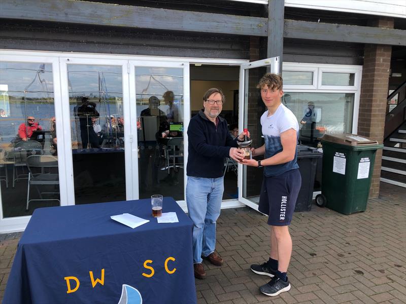 Will Sunderland receives the trophy in the Draycote Water Bank Holiday Pursuit Race photo copyright Edward Sunderland taken at Draycote Water Sailing Club and featuring the ILCA 7 class