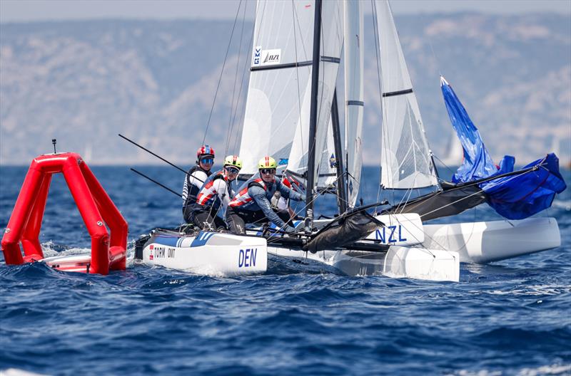 Micah Wilkinson/Erica Dawson (NZ) round behind Denmark - Nacra 17 -  Paris 2024 Olympic Sailing Test Event, Marseille, France - Day 8 - July 16, 2023 photo copyright Mark Lloyd / World Sailing taken at  and featuring the ILCA 7 class