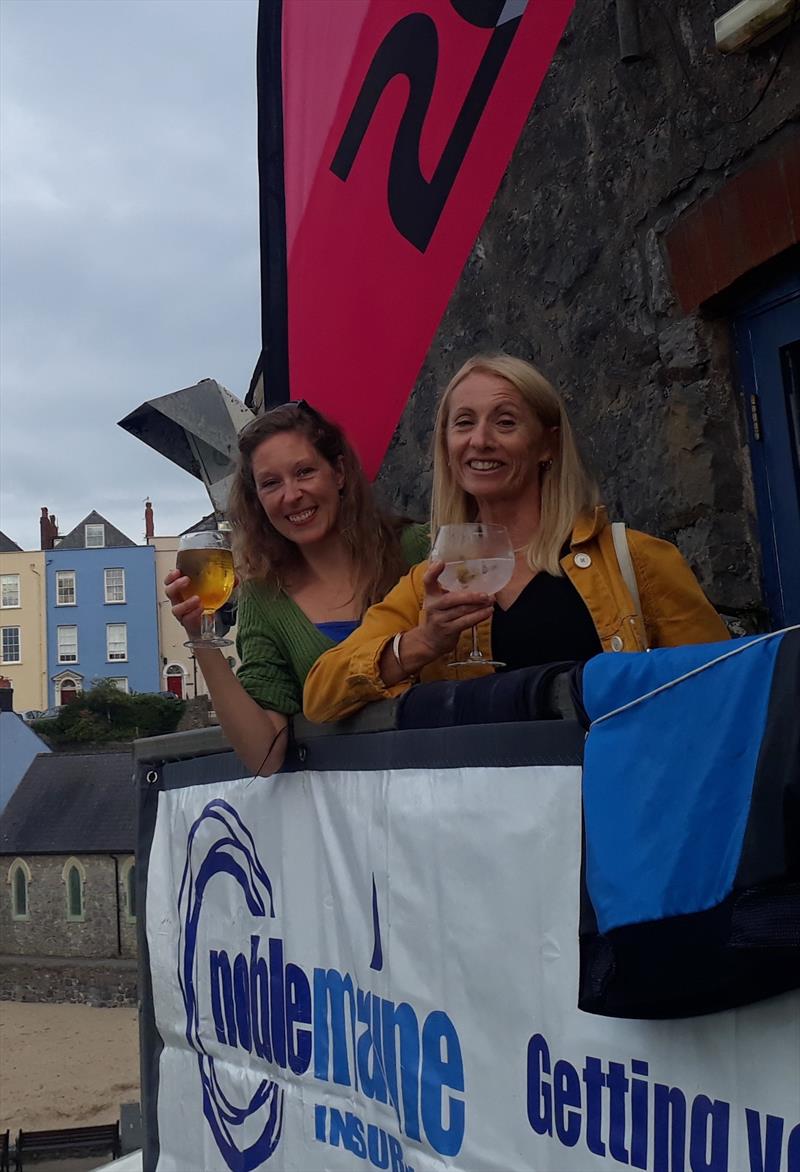 A brace of Lauras raise a toast to Noble Marine! (l-r) Laura Holmes & Laura Barnham photo copyright 2000 Class taken at  and featuring the 2000 class