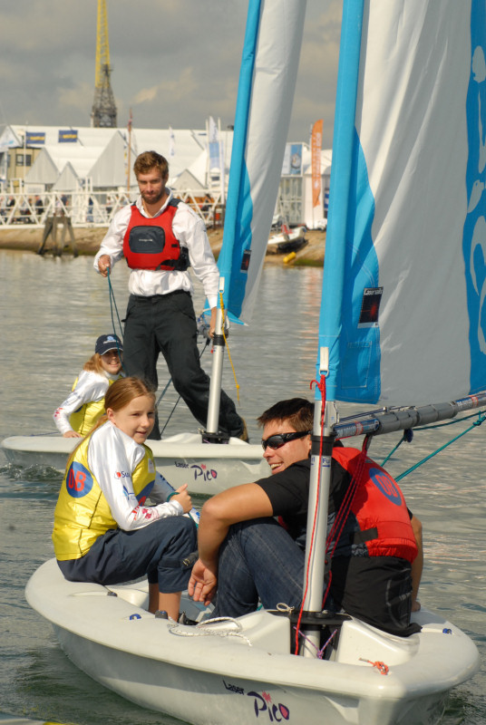 Iain Percy & Andrew 'Bart' Simpson giving youngsters at PSP Southampton Boat Show some top sailing tips as part of the RYA OnBoard 'Try sailing' programme photo copyright RYA OnBoard taken at  and featuring the Laser Pico class